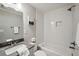 Bright bathroom with subway tile surround, vanity, and shower-tub combo at 2201 Plantation Ln, Atlanta, GA 30341