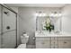 Clean bathroom design featuring a glass shower, toilet, and double sink vanity at 2201 Plantation Ln, Atlanta, GA 30341