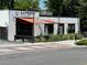 Modern Asian brewpub exterior with a stylish awning, sleek design, and contemporary outdoor seating area at 2201 Plantation Ln, Atlanta, GA 30341