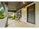 Inviting covered porch with seating, offering a cozy outdoor space to relax at 2201 Plantation Ln, Atlanta, GA 30341