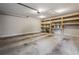 Spacious garage interior featuring shelving, painted walls, and concrete flooring at 2201 Plantation Ln, Atlanta, GA 30341