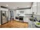 Updated kitchen featuring stainless steel appliances, granite countertops, and hardwood floors at 2201 Plantation Ln, Atlanta, GA 30341