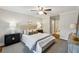 Serene bedroom with soft lighting, neutral tones, and an ensuite bathroom at 2201 Plantation Ln, Atlanta, GA 30341