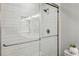 Modern bathroom shower with white subway tile, glass door, and sleek shower head at 2201 Plantation Ln, Atlanta, GA 30341