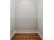 Organized walk-in closet with hardwood floors and wire shelving at 2201 Plantation Ln, Atlanta, GA 30341