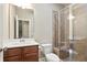 Clean, bright bathroom featuring standing shower with glass door and modern fixtures at 2720 Tuscany Park Dr, Lawrenceville, GA 30043