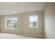 Bedroom featuring carpet, neutral walls, and two windows providing natural light at 2720 Tuscany Park Dr, Lawrenceville, GA 30043