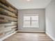 Bedroom featuring unique accent wall and big window allowing for lots of natural light at 2720 Tuscany Park Dr, Lawrenceville, GA 30043