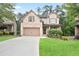 Charming two-story brick home with a well-maintained lawn and a two-car garage at 2720 Tuscany Park Dr, Lawrenceville, GA 30043