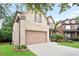 Lovely two-story brick home featuring a two-car garage and a well-manicured front yard at 2720 Tuscany Park Dr, Lawrenceville, GA 30043