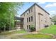 Brick home exterior featuring a backyard patio with a lush green lawn at 2720 Tuscany Park Dr, Lawrenceville, GA 30043