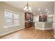 Open-concept space with an eat-in kitchen, hardwood floors, and views into another room at 2720 Tuscany Park Dr, Lawrenceville, GA 30043