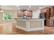 Open kitchen with hardwood floors, island with seating, and stainless-steel appliances at 2720 Tuscany Park Dr, Lawrenceville, GA 30043