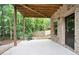 Covered back patio featuring concrete flooring, perfect for outdoor dining and relaxation at 2720 Tuscany Park Dr, Lawrenceville, GA 30043