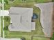 Aerial view highlighting backyard, trampoline, and mature trees bordering the property at 3748 Spring Place Ct, Loganville, GA 30052