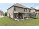 Expansive backyard with covered patio and trampoline offers plenty of room for activities at 3748 Spring Place Ct, Loganville, GA 30052