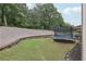 Backyard featuring a trampoline with ample space for recreation at 3748 Spring Place Ct, Loganville, GA 30052