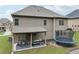 Backyard view with a covered patio and a trampoline at 3748 Spring Place Ct, Loganville, GA 30052