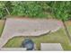 Aerial view of the backyard with a trampoline and a retaining wall at 3748 Spring Place Ct, Loganville, GA 30052