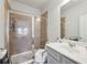 Bathroom features a shower with tile surround, glass door and safety bars at 3748 Spring Place Ct, Loganville, GA 30052