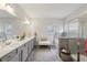 The large bathroom features a double sink vanity, a glass shower, and a tub with tile surround at 3748 Spring Place Ct, Loganville, GA 30052