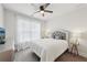 This bedroom features natural lighting, a comfortable bed, and stylish decorations at 3748 Spring Place Ct, Loganville, GA 30052
