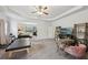 This bonus room features a ceiling fan, neutral walls, and opens into the main bedroom at 3748 Spring Place Ct, Loganville, GA 30052