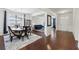 Open dining area with hardwood floors leading to a cozy living space at 3748 Spring Place Ct, Loganville, GA 30052