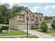 Beautiful two-story home with brick and siding, featuring a well-kept lawn and two car garage at 3748 Spring Place Ct, Loganville, GA 30052