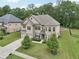 Beautiful two-story home with well-manicured lawn and mature trees provides great curb appeal at 3748 Spring Place Ct, Loganville, GA 30052