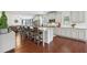 Open kitchen with stainless steel appliances, a large island, and hardwood floors at 3748 Spring Place Ct, Loganville, GA 30052