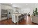 Spacious kitchen with gray cabinets, stainless steel appliances, double oven, and a large center island with bar seating at 3748 Spring Place Ct, Loganville, GA 30052