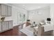 Cozy living room featuring neutral tones, french doors, and a tranquil view to the backyard at 3748 Spring Place Ct, Loganville, GA 30052