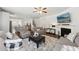 Spacious living room with a fireplace, hardwood floors, and neutral decor at 3748 Spring Place Ct, Loganville, GA 30052