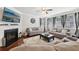 Cozy living room featuring a fireplace, large windows, and comfortable seating at 3748 Spring Place Ct, Loganville, GA 30052