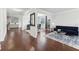 Spacious living room with hardwood floors, modern furniture, and an open floor plan at 3748 Spring Place Ct, Loganville, GA 30052