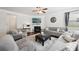 Bright living room with a fireplace, large windows, and comfortable seating at 3748 Spring Place Ct, Loganville, GA 30052