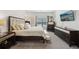 This main bedroom features beautiful furniture with a mounted television and an inviting bed set at 3748 Spring Place Ct, Loganville, GA 30052