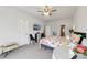 Bright main bedroom with ceiling fan, painting and ensuite bathroom entrance at 3748 Spring Place Ct, Loganville, GA 30052