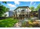 Backyard view with deck and staircase to upper level at 20 S Eugenia Nw Pl, Atlanta, GA 30318