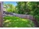 Fenced backyard with lush lawn offering privacy and space for outdoor activities at 20 S Eugenia Nw Pl, Atlanta, GA 30318