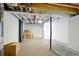 Unfinished basement with concrete walls and support beam at 20 S Eugenia Nw Pl, Atlanta, GA 30318