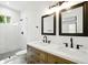 Bathroom featuring a glass enclosed shower, modern fixtures, and double vanity at 20 S Eugenia Nw Pl, Atlanta, GA 30318