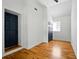 Small bedroom featuring hardwood floors, blue doors, and a vaulted ceiling at 20 S Eugenia Nw Pl, Atlanta, GA 30318