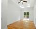 Inviting bedroom features new hardwood floors and sliding doors to the deck at 20 S Eugenia Nw Pl, Atlanta, GA 30318