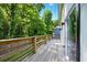 Wooden deck overlooks the lush, green backyard providing a relaxing outdoor space at 20 S Eugenia Nw Pl, Atlanta, GA 30318