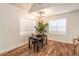 Dining area with hardwood floors, modern lighting, and plenty of natural light at 20 S Eugenia Nw Pl, Atlanta, GA 30318