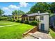 Charming home with lush lawn, covered porch and basement entrance at 20 S Eugenia Nw Pl, Atlanta, GA 30318