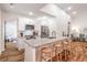 Well-lit modern kitchen with a granite counter island and stainless steel appliances at 20 S Eugenia Nw Pl, Atlanta, GA 30318