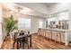 Open-concept kitchen featuring a large island, stainless steel appliances, and modern lighting at 20 S Eugenia Nw Pl, Atlanta, GA 30318